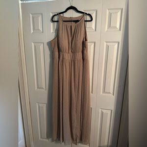 Cream colored formal dress with gold and silver accents.